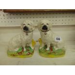 A pair of small early Staffordshire dogs