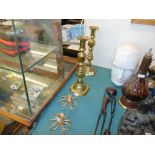 Pair of brass candlesticks plus another