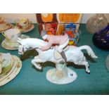 A horse and rider figurine