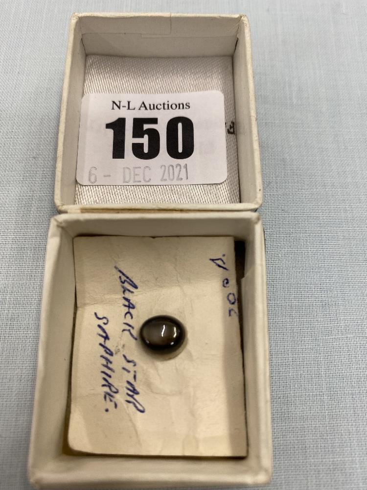 A boxed Black star Sapphire gem