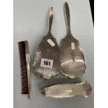 a four piece hallmarked silver dressing set