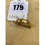A 22ct gold wedding band, size X,