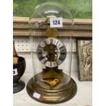 A brass and glass domed mantle clock working order