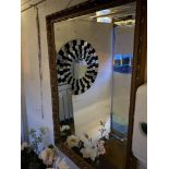 A gilt framed mirror