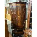 A mahogany corner cabinet,