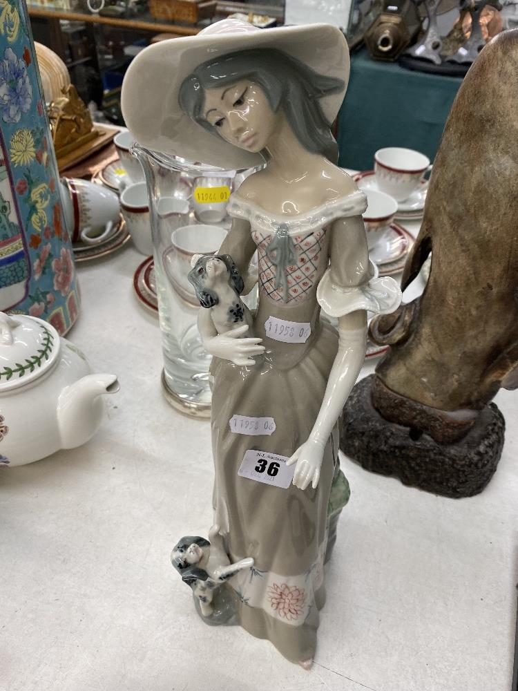 A tall lady figurine by Cascade