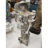 A tall lady figurine by Cascade