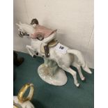 A horse and rider figurine