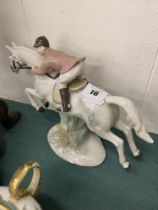 A horse and rider figurine