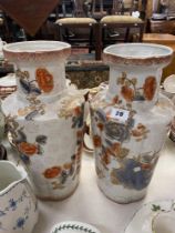 A pair of decorative Orange and White vases