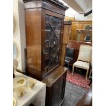 A mahogany bookcase on a cupboard base