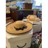 Two boxed ladies hats