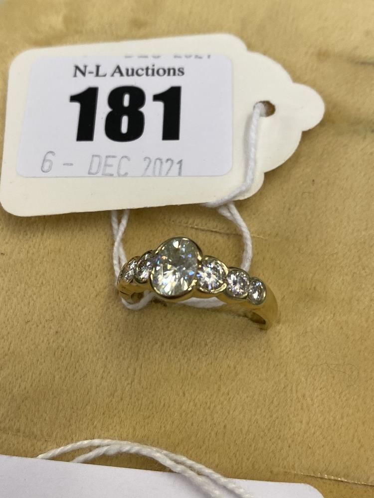 An 18ct gold, seven stone Diamond ring, total weight approx. 1.