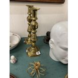 Pair of brass candlesticks plus another