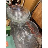 Three large glass bowls and a fruit bowl