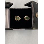 A pair of white gold Diamond and emerald earrings