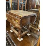 A small antique drop leaf table