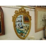 An ornamental gilt wall mirror