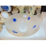 A studio glass bowl with blue mounts