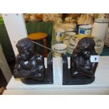 A pair of bronze and marble bookends