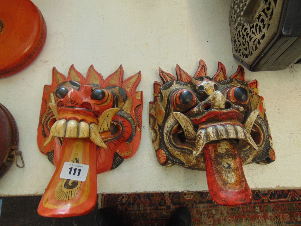 Two carved wooden masks