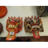 Two carved wooden masks