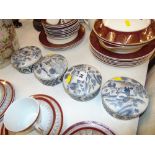 Four blue and white lidded pots