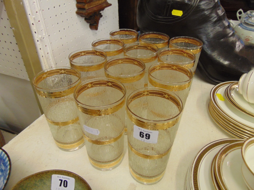 A set of 12 gold banded glasses