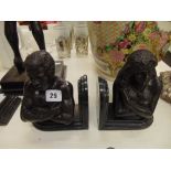 A pair of bronze and marble bookends