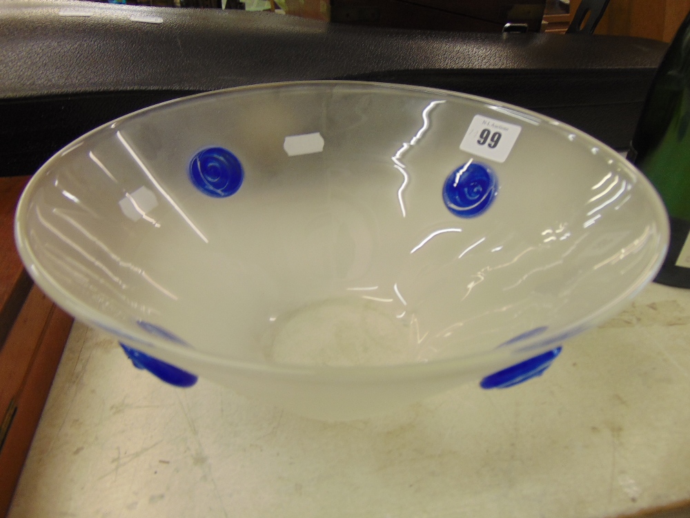 A studio glass bowl with blue mounts