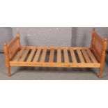 A pine single bed.