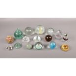 A collection of mostly glass paperweights, comprising of, a Millefiori paperweight, an Onyx multi