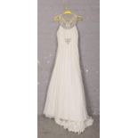 A designer wedding dress, Voyage Morilee by Madeline Gardner, Size 12-14.