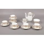 A Bone China Tea set with gilt edge detailing, Teapot, milk jug, sugar bowl, cups, saucers.