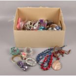 A box of costume jewellery, necklaces, bangles, beads etc