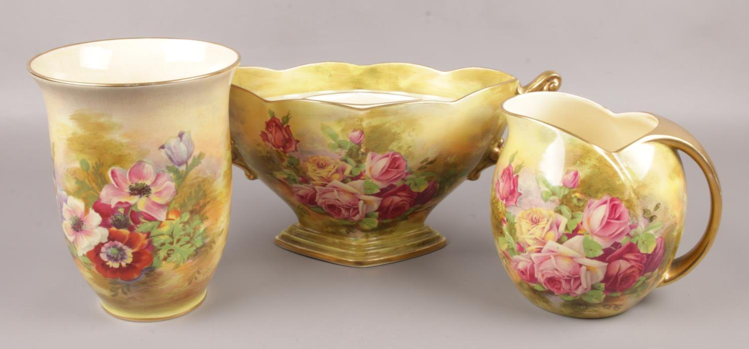 Three piece of Royal Winton Grimwades, floral design, to include two vases and a centrepiece.