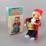 A tin plate wind-up Happy Harvey Japanese boxed toy.