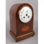 An Edwardian mahogany 8 day mantel clock, with enamel dial, Arabic numeral markers and inlaid