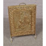 A Brass fire screen