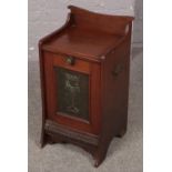 A Victorian mahogany coal box with copper panel inset and metal liner.