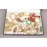 A small collection of costume jewellery to include cameo brooch, rings, necklaces, bangle, etc.