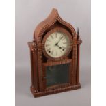 A carved Mahogany gingerbread clock. damage on top of clock