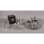 A silver plate teapot, sugar bowl, milk jug, serving tray to include two pewter tankards and AE