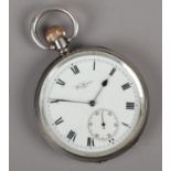 A silver Waltham pocket watch.