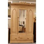 A pine mirror front wardrobe with drawer base. (216cm x 135cm)
