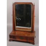 A mahogany toilet mirror with 3 drawer base and brass finials. (55cm x 38cm)