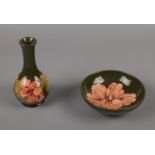 A Moorcroft 'Hibiscus' bud vase (16cm height), and bowl (diameter 14cm)