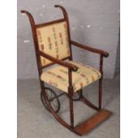 A Victorian mahogany wheelchair.