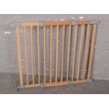 A Mothercare Wooden safety gate (76cm height, 89cm width)