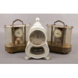 Three torsion clocks to include two West German Schmid Schlenker musical examples and a white